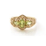 A three stone peridot ring