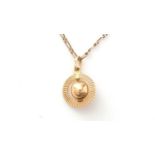 An 18ct yellow gold orb pattern pendant, on chain