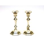 A pair of silver candlesticks, by William Hutton & Sons Ltd