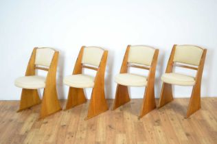 A set of four 1950s oak Cromwell chairs by E Gomme