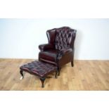 A reproduction Chesterfield wingback armchair