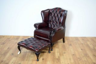 A reproduction Chesterfield wingback armchair