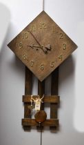 A stained oak wall clock