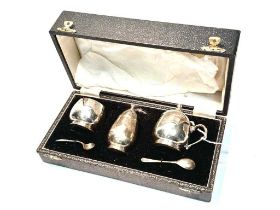 A three-piece silver condiment set, by Garrard & Co Ltd