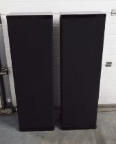 A pair of Mirage M-5 surround-sound floor-standing audio speakers