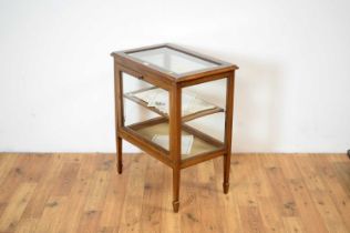 An Edwardian mahogany and satinwood banded glazed cabinet