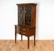 An early 20th Century mahogany cabinet on stand