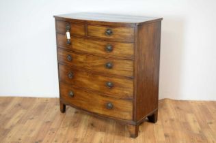 A George III mahogany and banded bow front chest of drawers