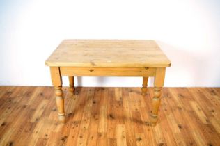 A 20th century pine table and chairs