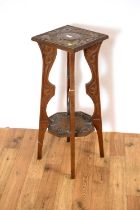 A late 19th Century carved oak jardiniere stand