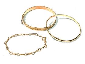 A 9ct yellow gold bangle, and bracelet and another bangle