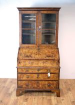 A Queen Anne burr walnut and walnut bureau bookcase