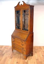 An Edwardian mahogany and satinwood banded bureau bookcase