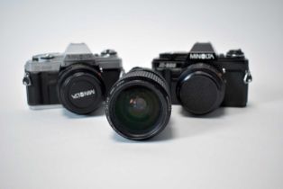 Two Minalta X-300 SLR cameras