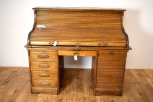 An early 20th Century oak roll top desk by Stolzenberg