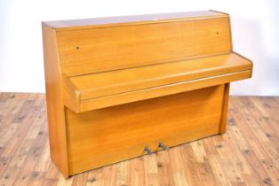 A Daneman upright piano, in a teak case