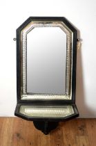 An early 20th Century ebonised wall shaving mirror