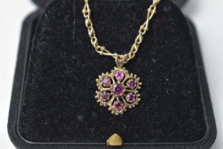 A ruby and 9ct yellow gold pendant
