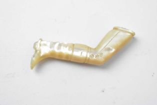 A 19th Century carved mother of pearl pipe tamper
