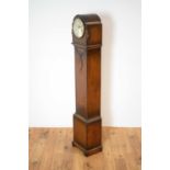 A 1930s oak chiming grandmother clock