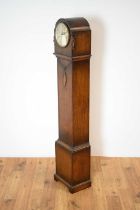 A 1930s oak chiming grandmother clock
