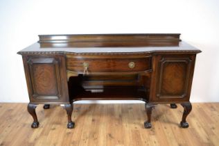 Waring and Gillows: An early 20th century mahogany bowfront sideboard