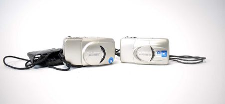 Two Olympus point-and-shoot cameras