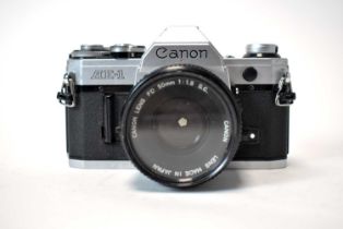 A Canon AE-1 camera and lens