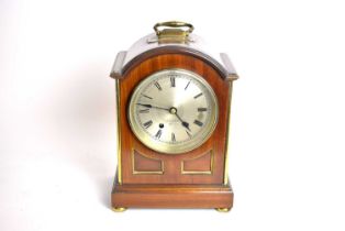 A Victorian dome cased mantel clock