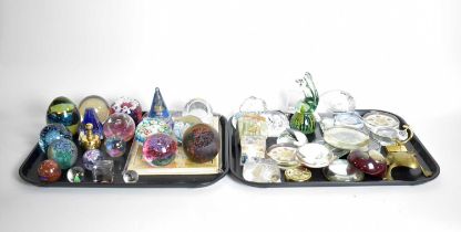 A collection of glass and other paperweights