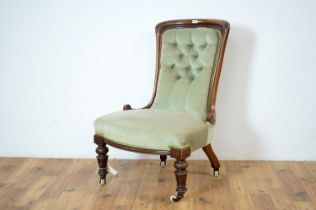 A Victorian walnut framed nursing chair