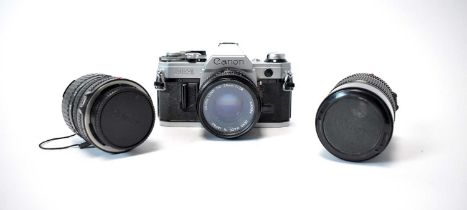 A Canon AE-1 camera and lenses