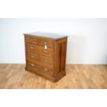 An Edwardian walnut chest of drawers