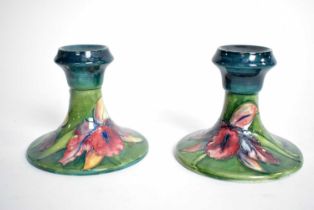 A pair of Moorcroft ceramic candlesticks