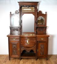 An Edwardian carved walnut mirror back bow front sideboard