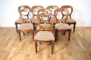 A set of eight Victorian balloon back chairs