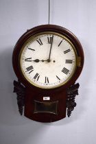 A mahogany wall clock