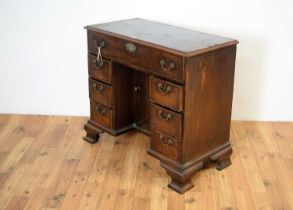 A mid 18th Century mahogany kneehole desk with secretaire drawer,