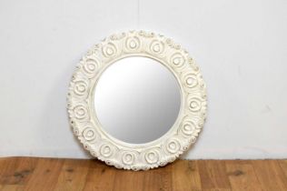 A contemporary circular wall mirror