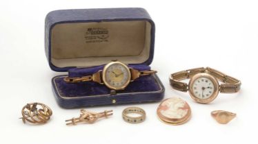 A gold wristwatch and other jewellery