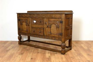 Siesta by N.H Chapman of Newcastle upon Tyne: A Jacobean Revival oak sideboard