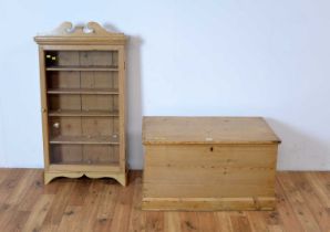A stripped pine blanket box together with a hanging display cabinet