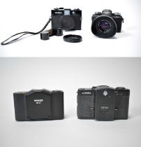 Two Minolta cameras, a Minox 35 GT, and a Lomo LC-A camera