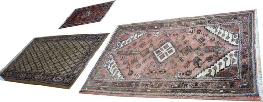 A collection of three vintage Persian Islamic rugs