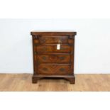 A late 19th Century early 20th Century walnut and burr walnut banded chest of drawers