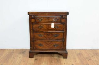 A late 19th Century early 20th Century walnut and burr walnut banded chest of drawers