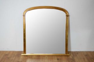 A reproduction gilt overmantel mirror