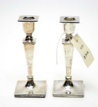 A pair of early 20th Century silver candlesticks, by Walker & Hall