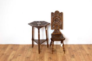 A carved oak hall table together with a carved oak hall chair