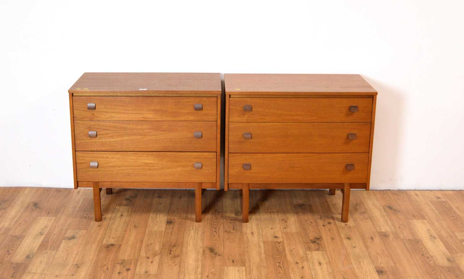 A pair of retro teak chest of drawers